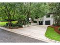 White brick home with two-car garage and driveway at 1201 Bancroft St, Raleigh, NC 27612