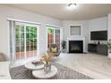 Spacious living room with fireplace and sliding glass doors leading to a deck at 202 Linden Park Ln, Cary, NC 27519