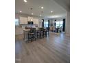 Modern kitchen with large island and breakfast bar at 1491 Pecan Dr # Model Home, Nashville, NC 27856