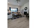 Open living room with fireplace and large windows at 1491 Pecan Dr # Model Home, Nashville, NC 27856
