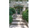 Stone house with a charming front entrance and steps at 2501 Kenmore Dr, Raleigh, NC 27608