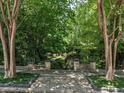 Landscaped yard with stone walkway leading to the house at 2501 Kenmore Dr, Raleigh, NC 27608
