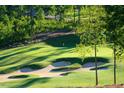Aerial view of a green golf course with sand traps at 95 Old Hickory, Pittsboro, NC 27312