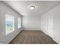 Spacious bedroom with neutral carpeting at 6631 Perry Creek Rd, Raleigh, NC 27616
