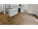 Modern kitchen with stainless steel appliances and an island at 2200 Wild Apple Ct, Apex, NC 27523