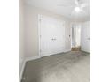 Spacious bedroom with double doors and carpet flooring at 2200 Wild Apple Ct, Apex, NC 27523