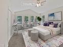 Virtually staged main bedroom with a large bed and ample natural light at 1421 Athens Dr, Raleigh, NC 27606