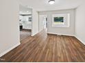 Bright living room with hardwood floors and an open concept floor plan at 1421 Athens Dr, Raleigh, NC 27606