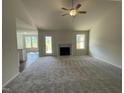 Spacious living room features a fireplace, vaulted ceilings and an open floor plan at 66 Tulipfield Way, Benson, NC 27504