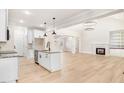 Modern kitchen with white cabinets, granite countertops and stainless steel appliances at 4155 Us-421, Lillington, NC 27546