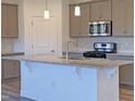 Modern kitchen with gray cabinets, granite countertops and an island at 108 Ascot, Rocky Mount, NC 27804
