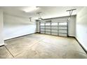 Spacious two-car garage with open layout and neutral-colored flooring at 211 Hopewell Branch Ct, Smithfield, NC 27577