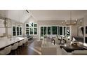 Open floor plan great room with kitchen, seating area and access to backyard at 9417 Rawson Ave, Raleigh, NC 27613