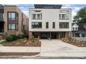 Modern two-unit building with attractive brick exterior and attached garages at 515 W Lenoir St # 101, Raleigh, NC 27601