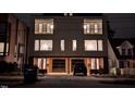 Modern two-unit building at night, illuminated and showcasing architectural details at 515 W Lenoir St # 101, Raleigh, NC 27601