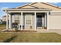 Gray siding house with a covered porch and a neatly landscaped front yard at 1261 Zoysia Dr, Rocky Mount, NC 27801