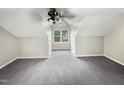 Large bedroom with grey carpet and ceiling fan at 104 Deerwalk Ct, Cary, NC 27513