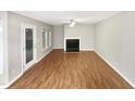 Spacious living room with hardwood floors and fireplace at 104 Deerwalk Ct, Cary, NC 27513