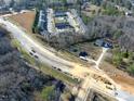 Aerial view of townhomes, pool, and new road construction in progress at 1229 Tulip St, Clayton, NC 27520