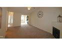 Bright living room featuring a fireplace and access to other rooms at 11370 Clubhaven Pl # 103, Raleigh, NC 27617