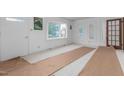 Living room with carpet, large window, and door to another room at 2509 Mckinney St, Burlington, NC 27217