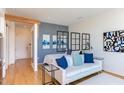 Open living area with white sofa and decorative wall accents at 515 N Mangum St # 51, Durham, NC 27701