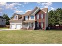 Two story home with brick and siding, two-car garage at 522 Old Field Loop, Sanford, NC 27332