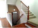 View from above of an interior staircase with hardwood floors and carpet at 5825 Cameo Glass Way, Raleigh, NC 27612