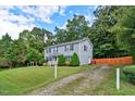 Two-story house with gravel driveway and fence at 8513 Kenridge Ln, Fuquay Varina, NC 27526