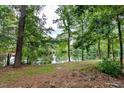 Peaceful pond view with lush green trees at 8513 Kenridge Ln, Fuquay Varina, NC 27526