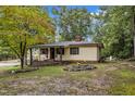 Charming ranch home nestled in a wooded setting with a spacious yard at 9336 Baileywick Rd, Raleigh, NC 27615