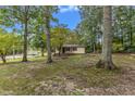 Ranch home surrounded by lush trees and landscaping at 9336 Baileywick Rd, Raleigh, NC 27615