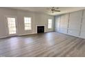 Large living room featuring hardwood floors, fireplace, and access to back deck at 86 Lupin Dr, Smithfield, NC 27577