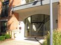 Main entrance to building with glass doors and stairs at 7250 Nc 751 Hwy # 2101, Durham, NC 27707