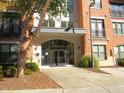 Main entrance of a brick building with landscaping at 7250 Nc 751 Hwy # 2101, Durham, NC 27707