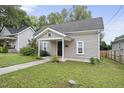 House exterior with a front porch and walkway at 204 W Hill St, Benson, NC 27504