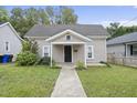 Cute house exterior with a front porch and walkway at 204 W Hill St, Benson, NC 27504
