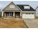 Brick and shingle two-story house with a two-car garage at 1055 Fairhaven Dr # 56, Mebane, NC 27302