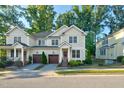 Two story tan home with attached garage and landscaping at 532 Lena Cir, Chapel Hill, NC 27516