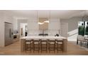 Modern kitchen with large island and contemporary lighting at 2209 Paddstowe Main Way, Wake Forest, NC 27587