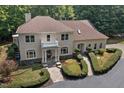 Two story house with balcony, stone accents, and lush landscaping at 6300 Swallow Cove Ln, Raleigh, NC 27614