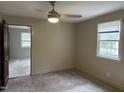 Bright bedroom featuring carpeted floors and a window with blinds at 511 Usher St, Durham, NC 27704