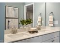 Modern bathroom with double vanity, quartz countertop, and stylish mirror at 227 Anise Ln, Garner, NC 27529