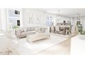 Open concept living and dining area with hardwood floors at 2408 Adrift Road, Fuquay Varina, NC 27526