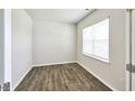 Bright bedroom with wood flooring and window blinds at 1348 Lansdowne Dr # 449, Mebane, NC 27302