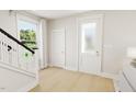 Bright entryway with stairs, coat closet and front door at 2404 Adrift Rd, Fuquay Varina, NC 27526