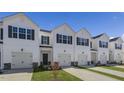 Five-unit townhome building with white siding and attached garages at 482 David Hill Dr, Sanford, NC 27330