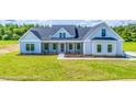 Modern farmhouse exterior with gray siding and landscaping at Tbd 1 Cedar Lane Rd, Sanford, NC 27332