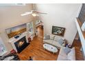 Upstairs living room with hardwood floors and fireplace at 7945 Parker Mill Trail, Fuquay Varina, NC 27526