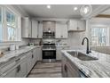 Spacious kitchen with stainless steel appliances, granite countertops, and ample cabinet space at 145 Leisure Ln, Louisburg, NC 27549